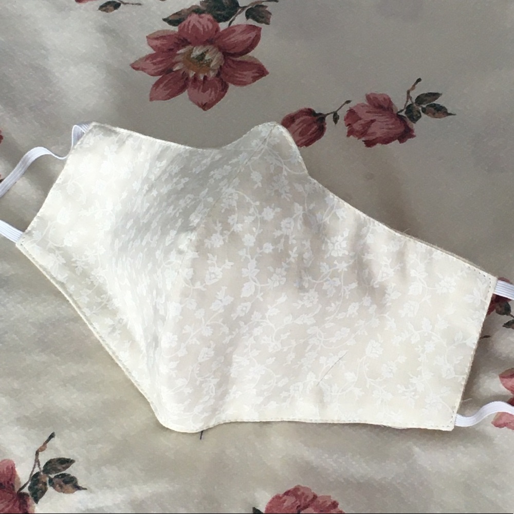 Daisies on ivory, floral face mask